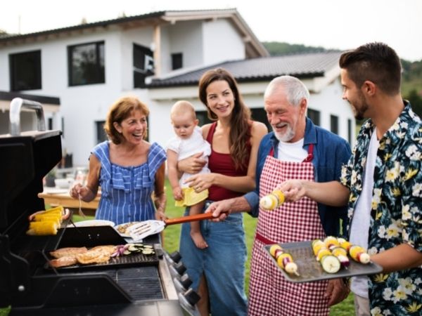 People enjoying barbecue in a pest free backyard