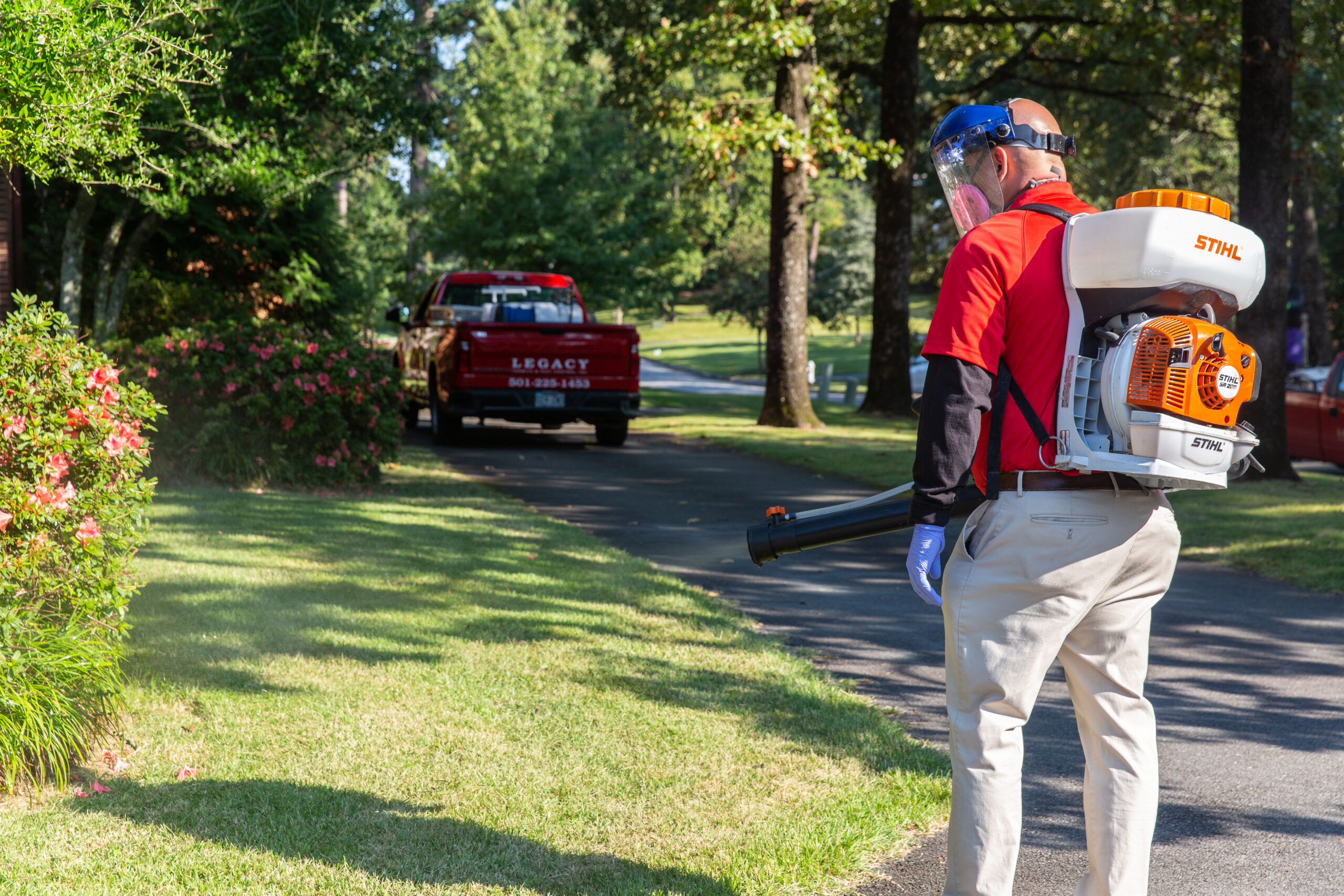 Legacy technician performing mosquito control